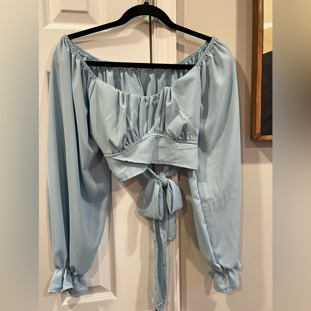 Off the shoulder light blue long sleeve wrap shirt